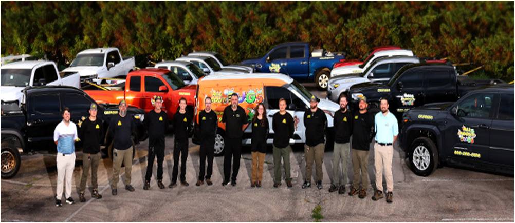 The All About Bugs Team with Fleet of Vans